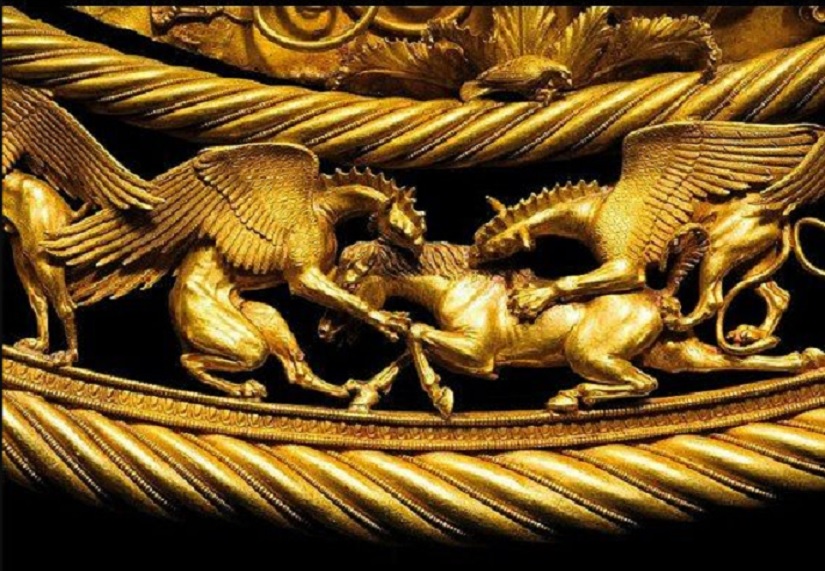 Ancient Scythian golden relief showing griffins attacking horse